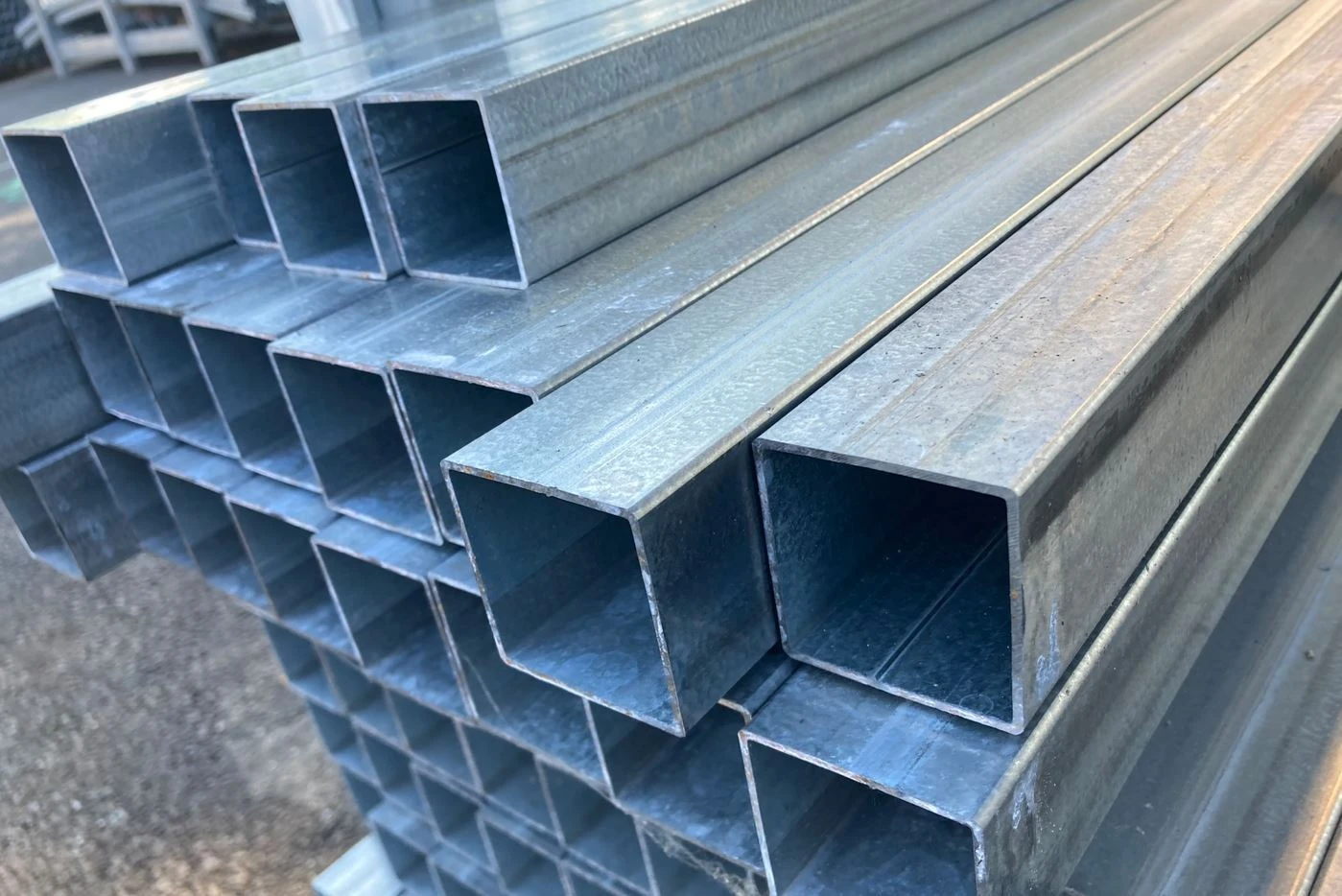 Stacked galvanised square tubes